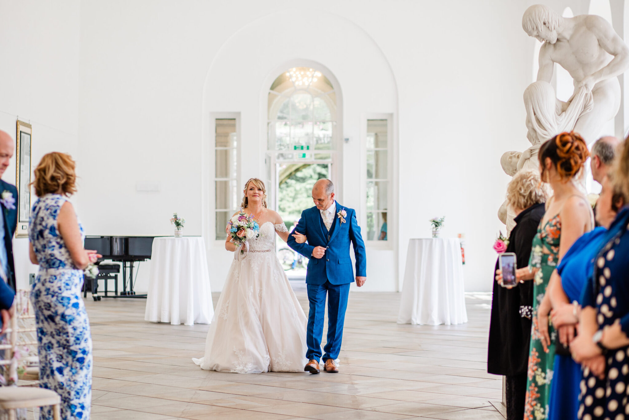 Bride and her dad entering the wedding ceremony